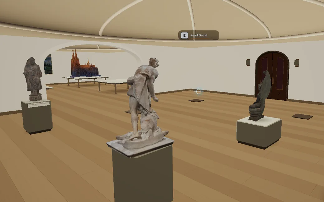 Sculptures on plinths in the ship's museum, with a model cathedral in the next room.